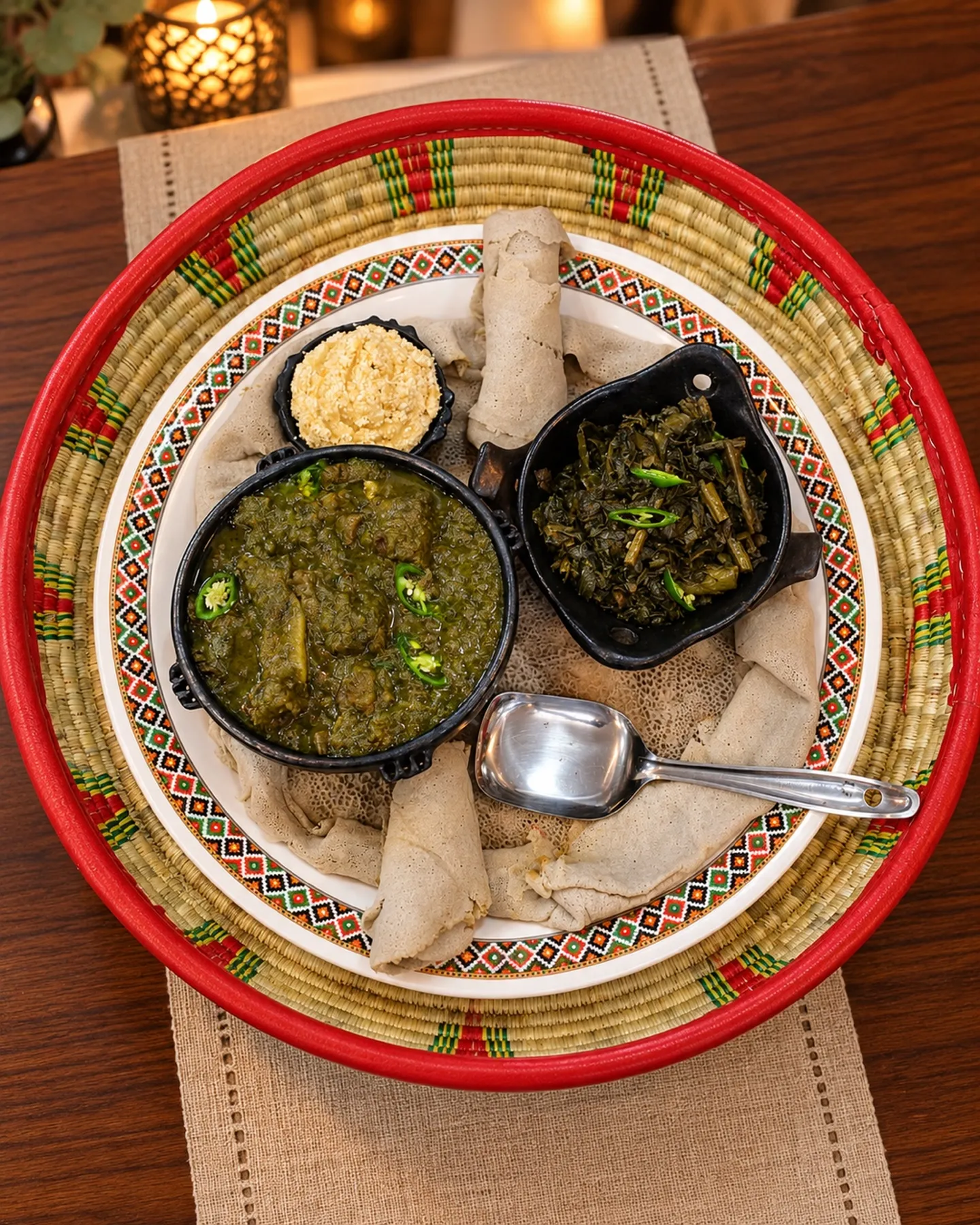Mesob basket — stews and greens on injera